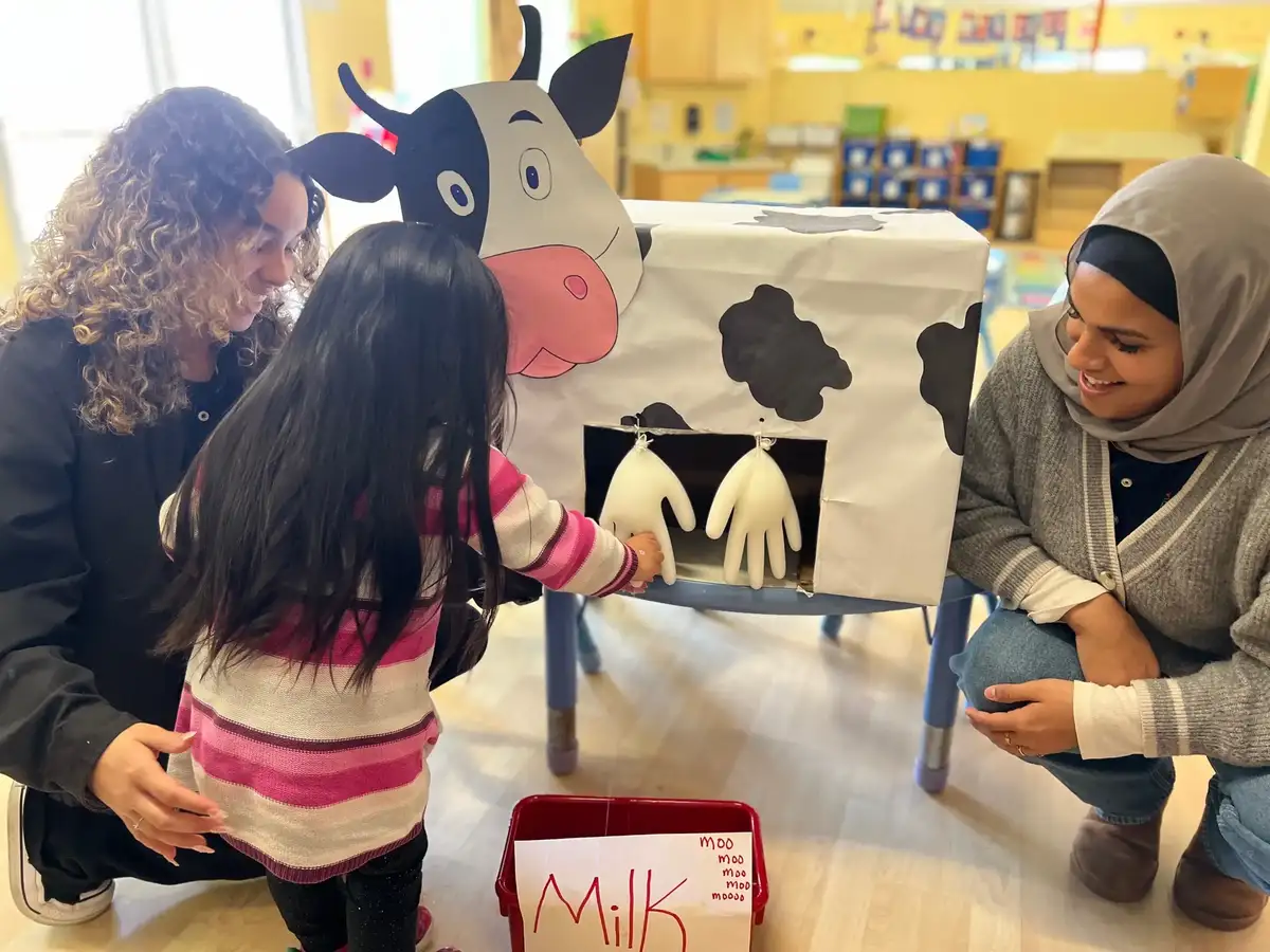 Three to four year old children engaged in guided discovery activities and structured hands-on learning in a Junior Pre-K…