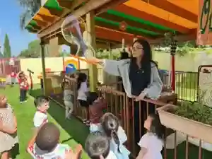 OC Kids Preschool teacher with children in a learning activity