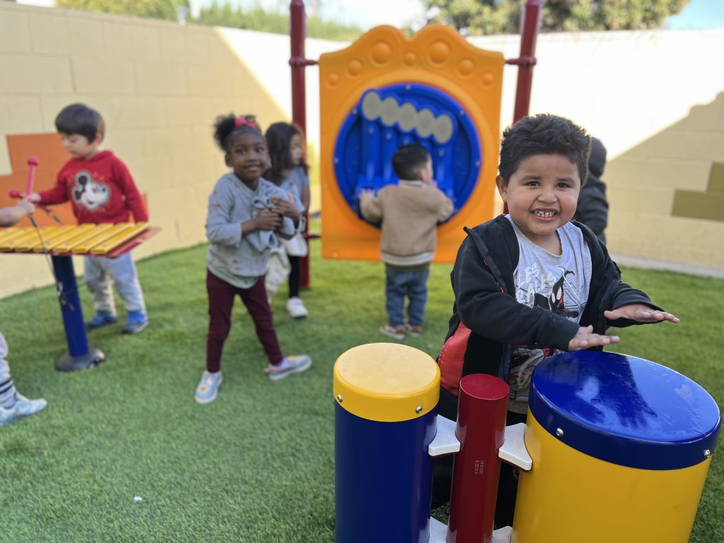 Recess time at Anaheim preschool with kids running and laughing