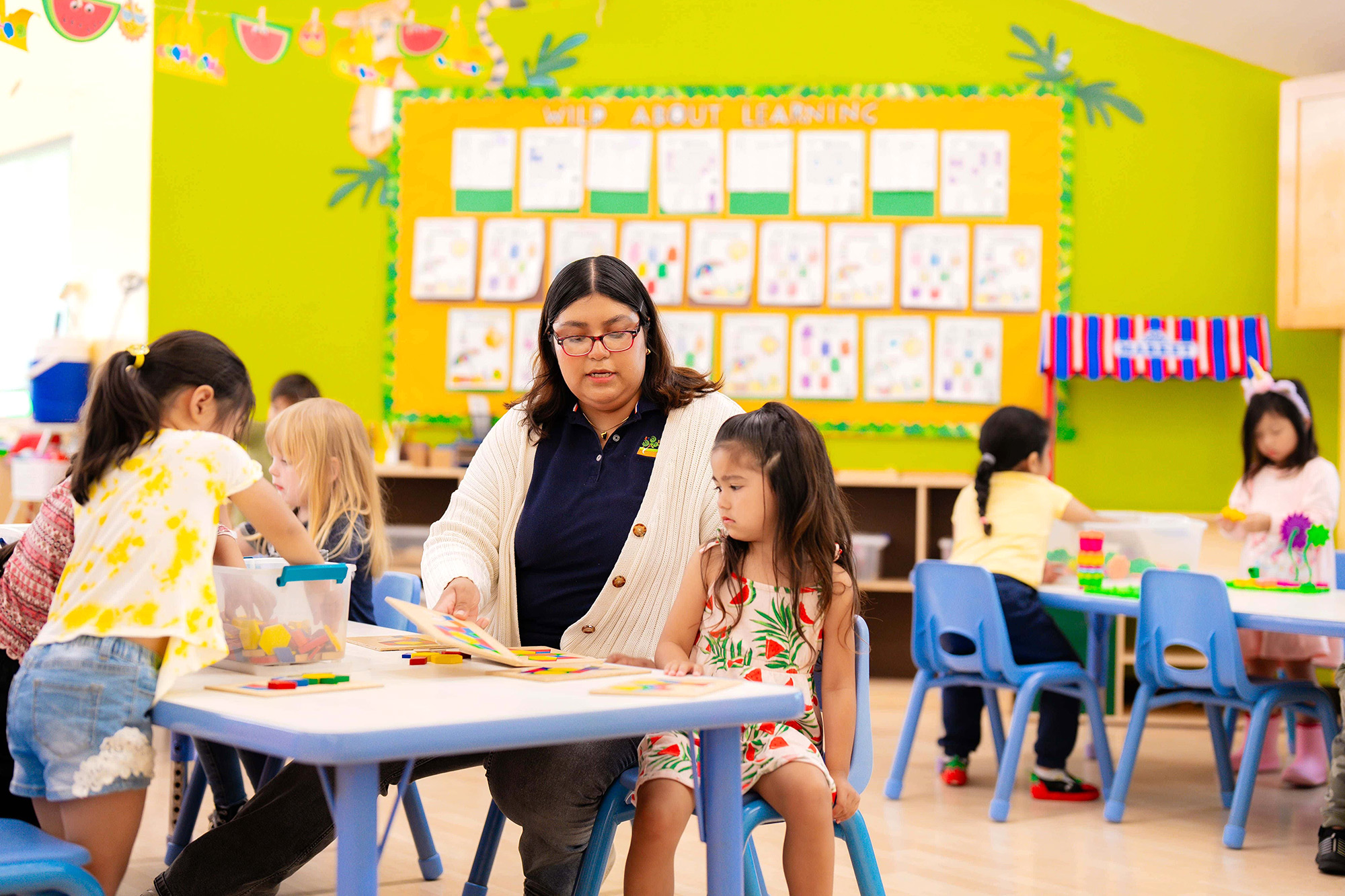Teachers and staff in Anaheim Preschool guiding classroom learning